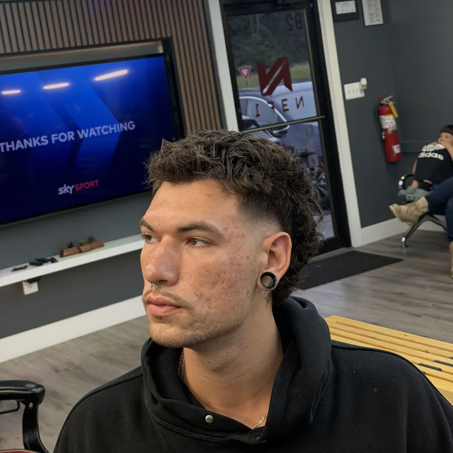 Curly top with a low taper fade