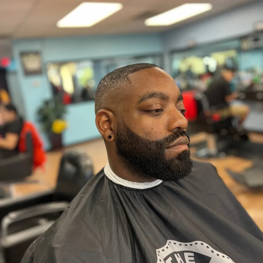 Clean bald look with a full beard