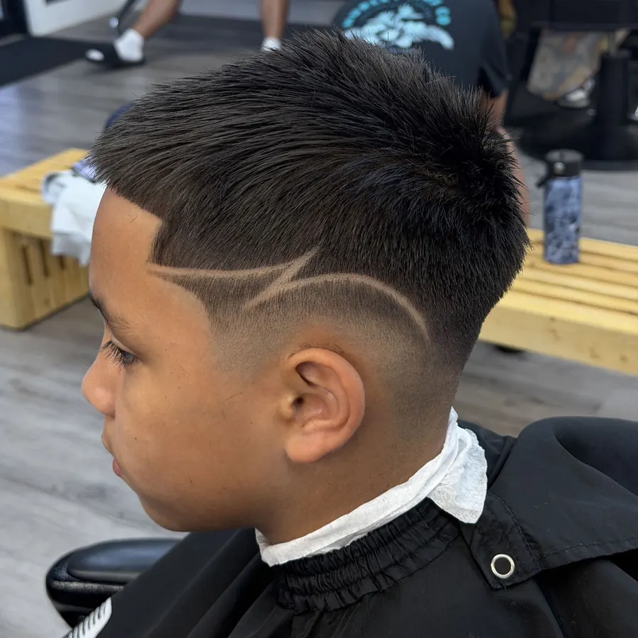 Kid’s fade with a lightning-bolt design